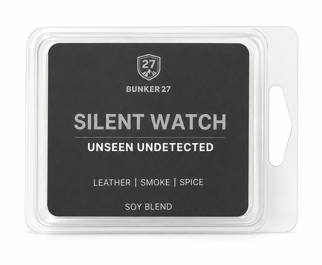 A packaged wax melt or scented melt product in a clear clamshell package with a dark charcoal label. The label reads 'BUNKER 27', 'SILENT WATCH', 'UNSEEN UNDETECTED', 'LEATHER | SMOKE | SPICE', and 'SOY BLEND'.