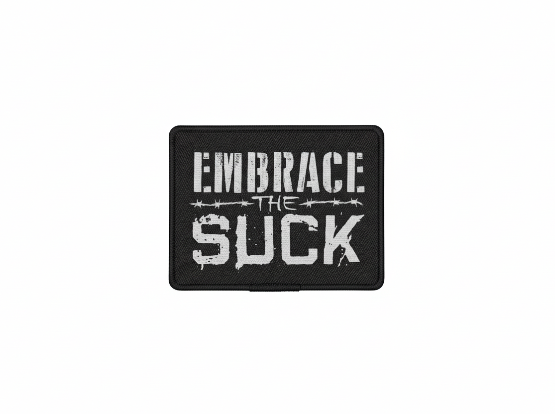 Motivational poster with text 'Embrace the Suck' and dimensions on a white background