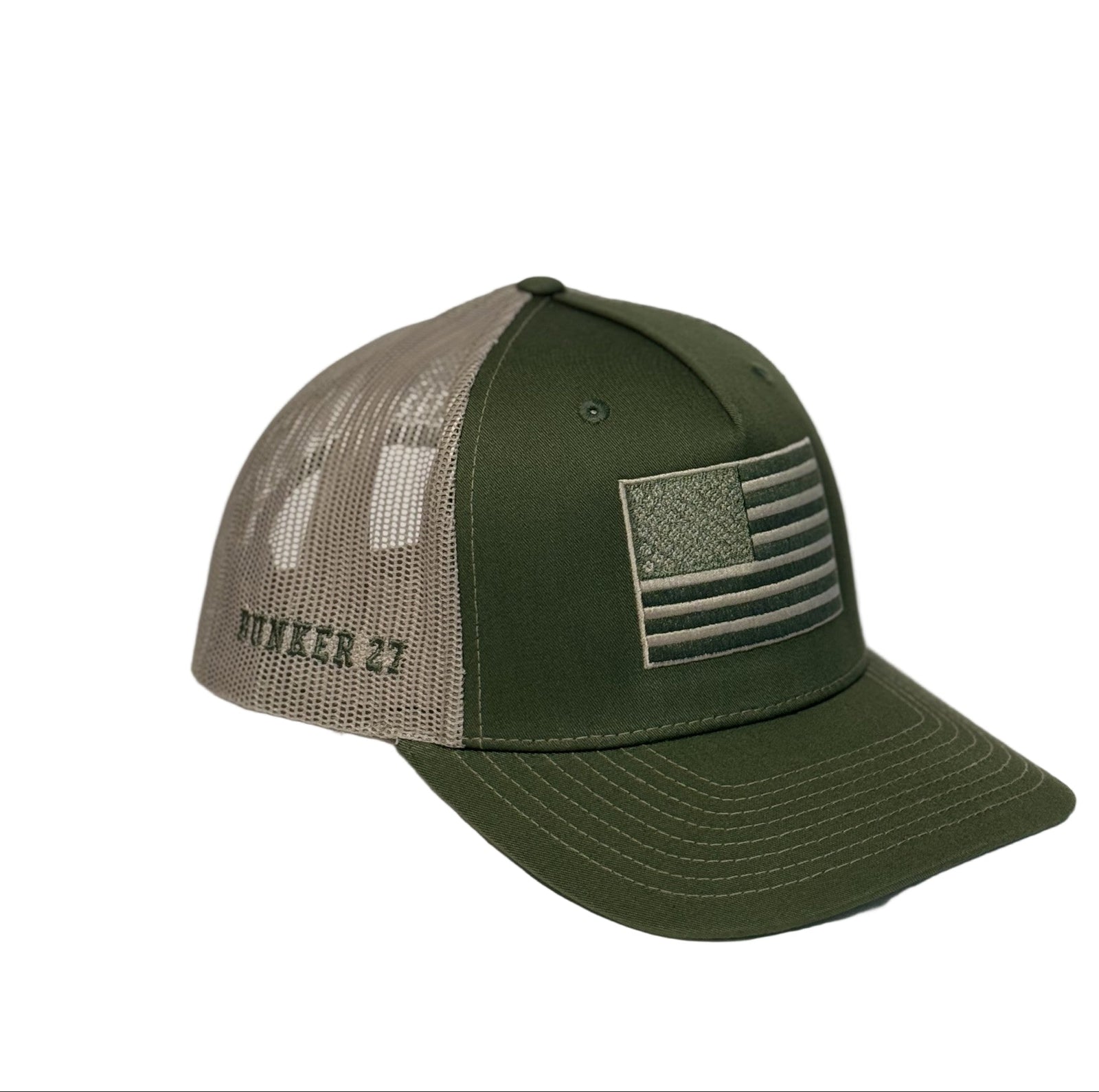 Green and beige cap with American flag patch on a white background